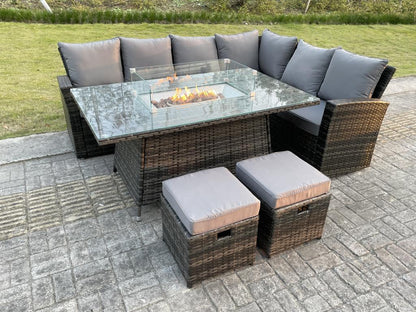 Rattan garden dining furniture with sofa, gas fireplace table, and stools. MéMeubiana dark grey